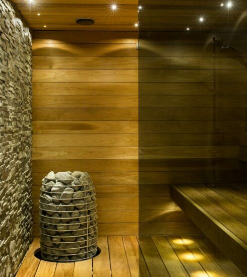 brown wooden round table near gray concrete wall